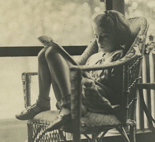 A young Joan Mitchell reading. Courtesy of the Joan Mitchell Foundation.