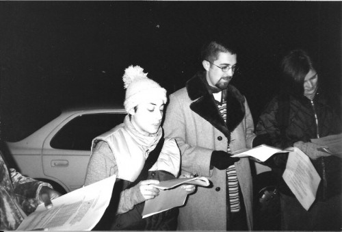 Laura Goldstein (left) and Maggie Zurawski (far right) poetry caroling along Baltimore Avenue, 1999.