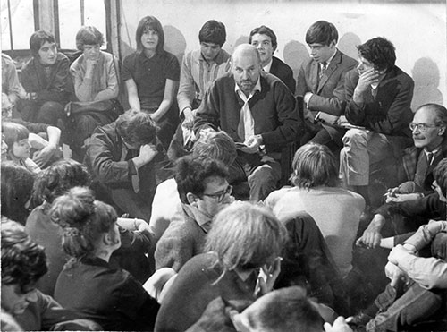 Ferlinghetti reading at the Morden Tower in 1965, surrounded by Basil Bunting, Gregory Corso, Claude Rawson, and others.