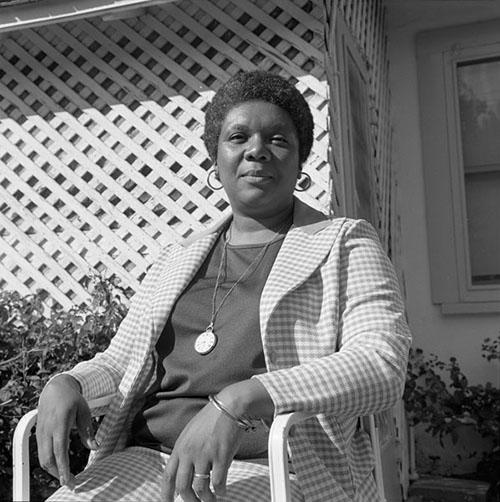 Poet Lucille Clifton sits in a checkered suit at the University of Arizona Poetry Center during her visit for the Center's Fall 1975 Reading and Lecture Series. 