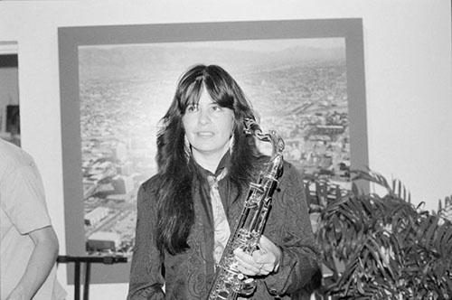 Poet and musician Joy Harjo with her saxophone. 1990.