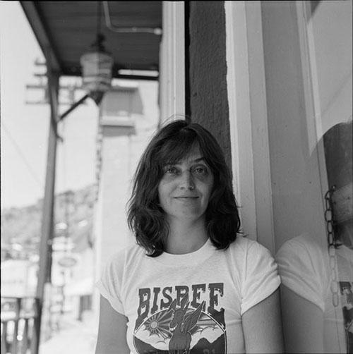 Poet Alice Notley wears a white Bisbee t-shirt at the 1981 Bisbee Poetry Festival in Bisbee, Arizona. 