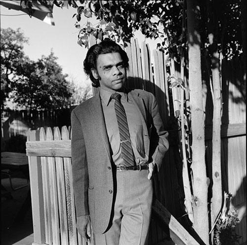 Poet, folklorist, and translator A.K. Ramanujan poses with one hand on his left hip at The University of Arizona Poetry Center for the Poetry Center's Spring 1972 Reading and Lecture Series. 